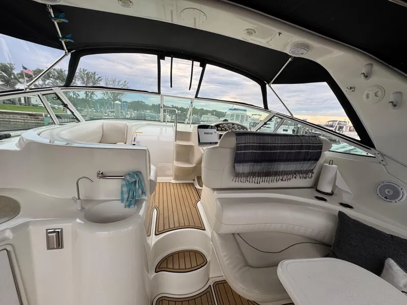 Slide: The Image of Interior of 2000 Cruisers Yachts 3870 Express, featuring seating and helm area. - 15