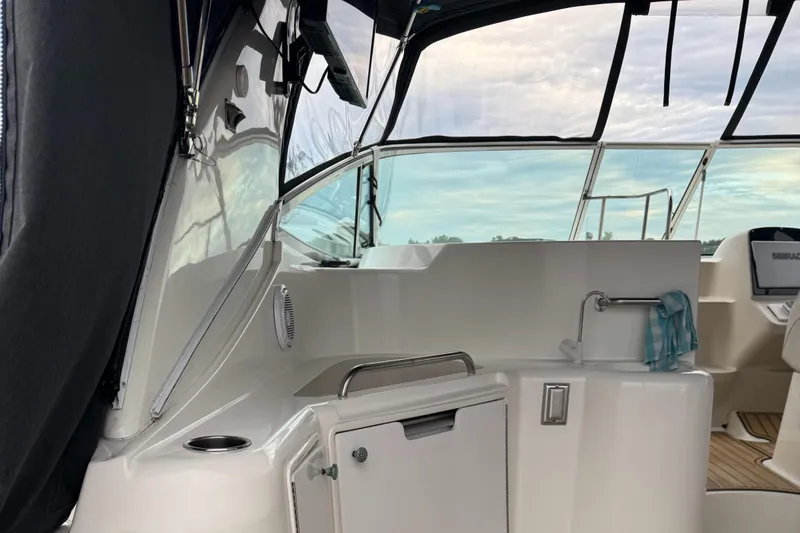 Slide: The Image of 2000 Cruisers Yachts 3870 Express cockpit with sink and seating area. - 17