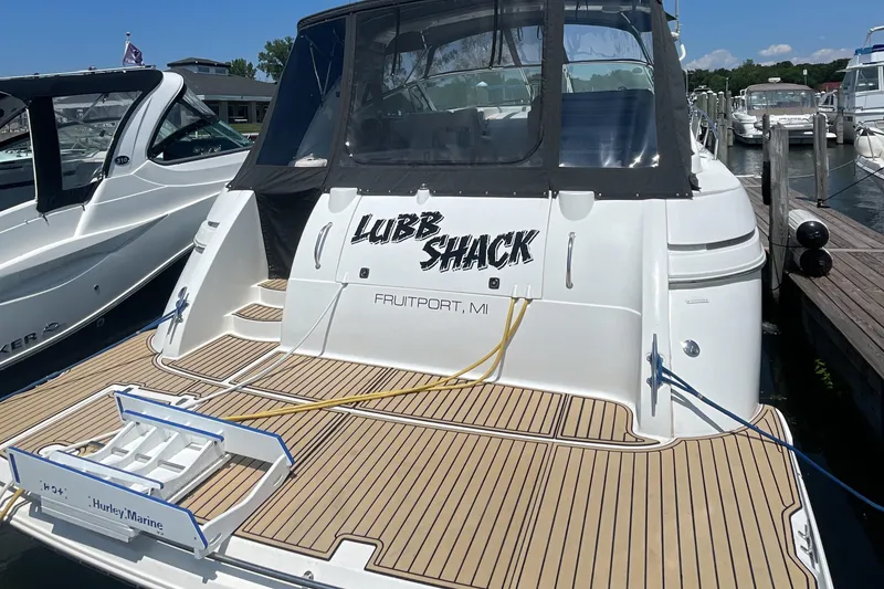 Slide: The Image of 2000 Cruisers Yachts 3870 Express docked, featuring "Lubb Shack" name and Fruitport, MI location. - 2