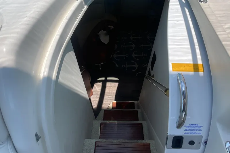 Slide: The Image of Stairway leading to cabin interior of 2000 Cruisers Yachts 3870 Express. - 25