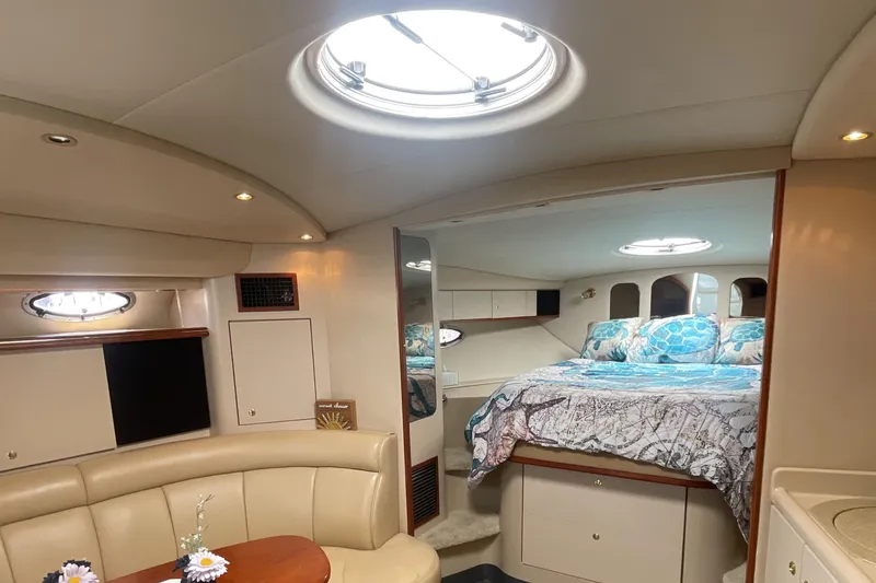 Slide: The Image of Interior of 2000 Cruisers Yachts 3870 Express with cozy bed and seating area. - 33