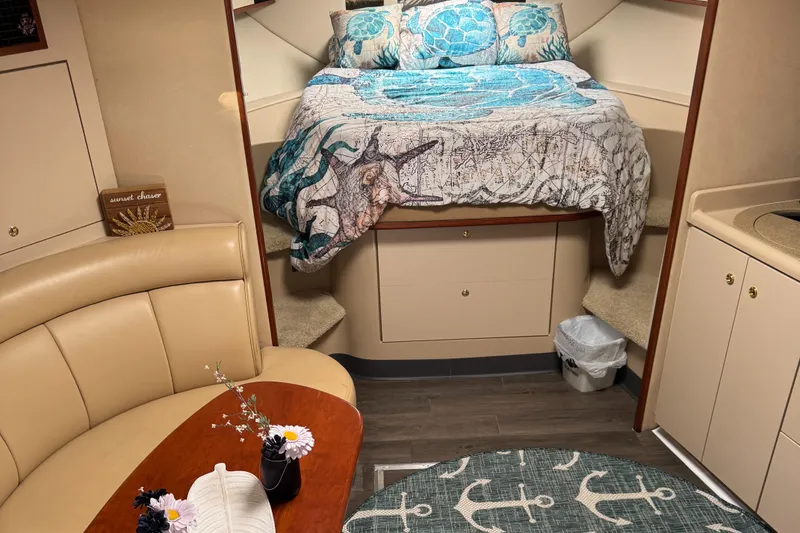 Slide: The Image of Interior of 2000 Cruisers Yachts 3870 Express with cozy bed and seating area. - 37