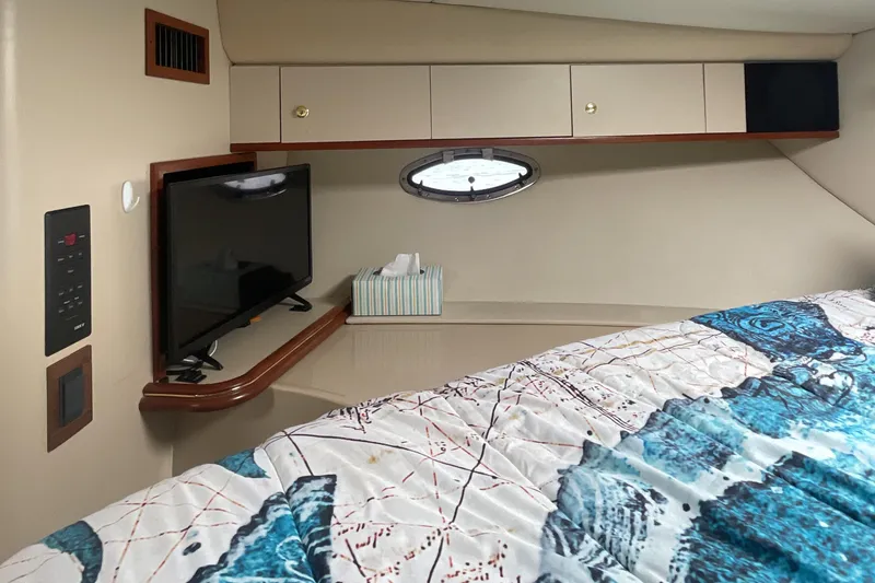 Slide: The Image of Interior of 2000 Cruisers Yachts 3870 Express with TV and storage cabinets. - 40