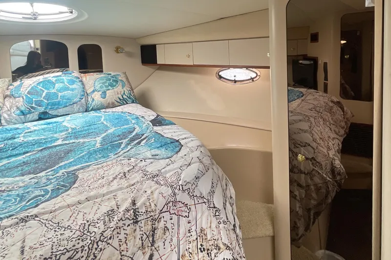 Slide: The Image of Interior cabin of 2000 Cruisers Yachts 3870 Express with turtle-themed bedding. - 41