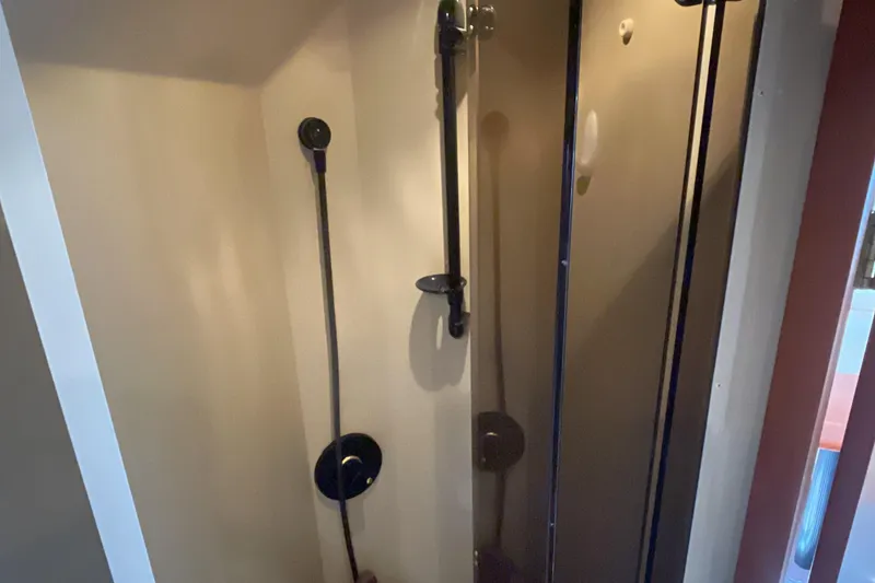 Slide: The Image of Shower area inside 2000 Cruisers Yachts 3870 Express, featuring modern fixtures and sleek design. - 45