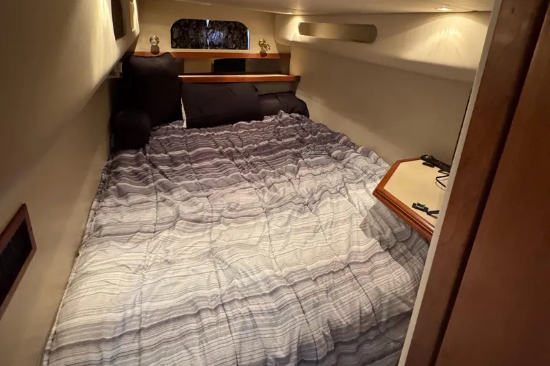 Slide: The Image of Cozy cabin interior of 2000 Cruisers Yachts 3870 Express with comfortable bedding. - 53