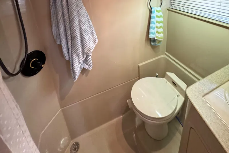 Slide: The Image of Bathroom interior of 2000 Cruisers Yachts 3870 Express with shower and toilet. - 60