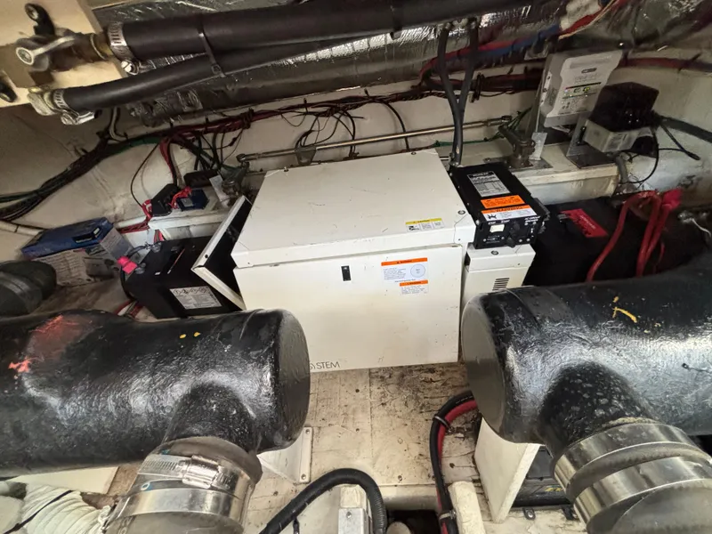 Slide: The Image of Engine room of 2000 Cruisers Yachts 3870 Express with generator and wiring. - 64