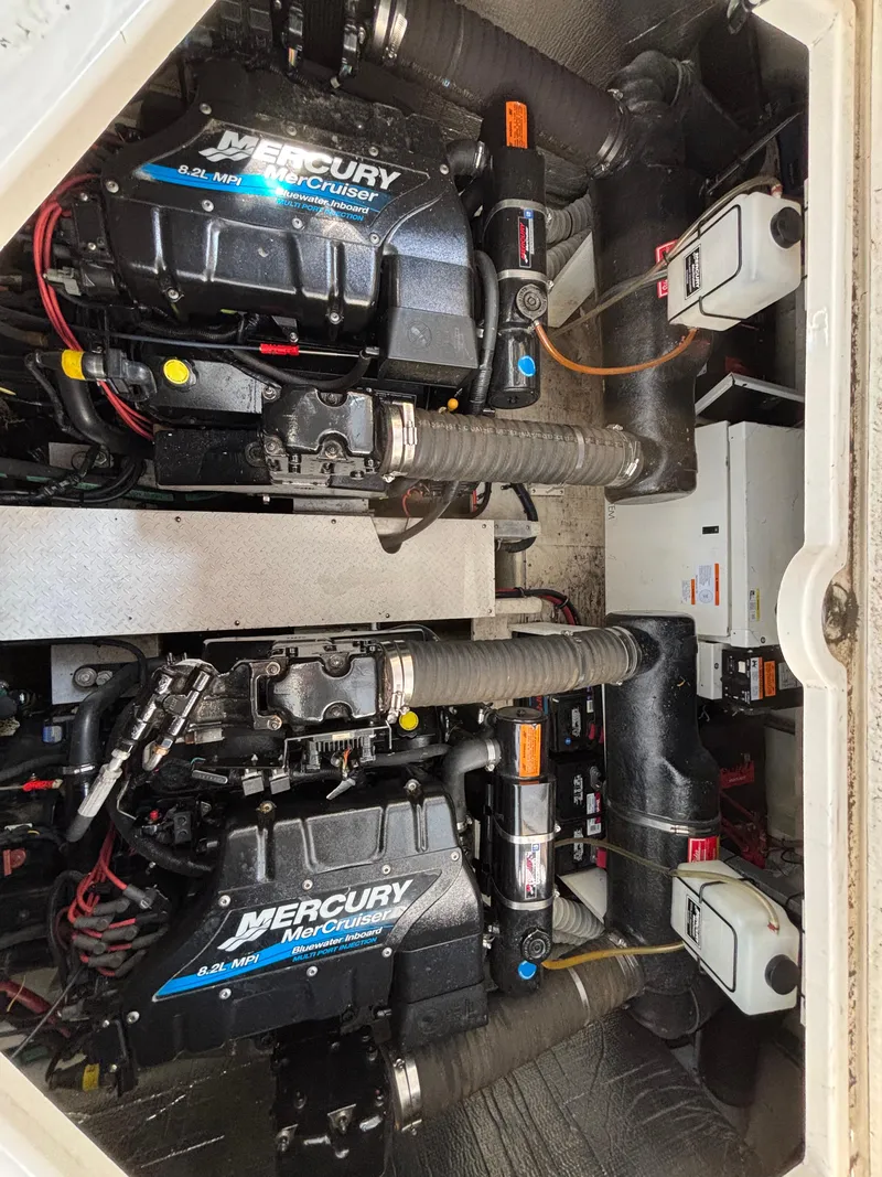 Slide: The Image of Engine compartment of 2000 Cruisers Yachts 3870 Express with Mercury MerCruiser engines. - 67