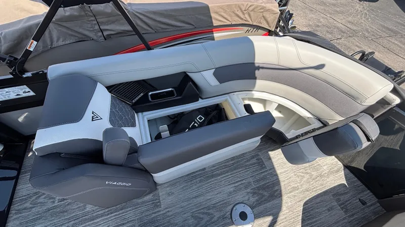 Slide: The Image of 2025 Viaggio Diamante D26U boat interior with gray and white seating, showcasing storage space. - 13
