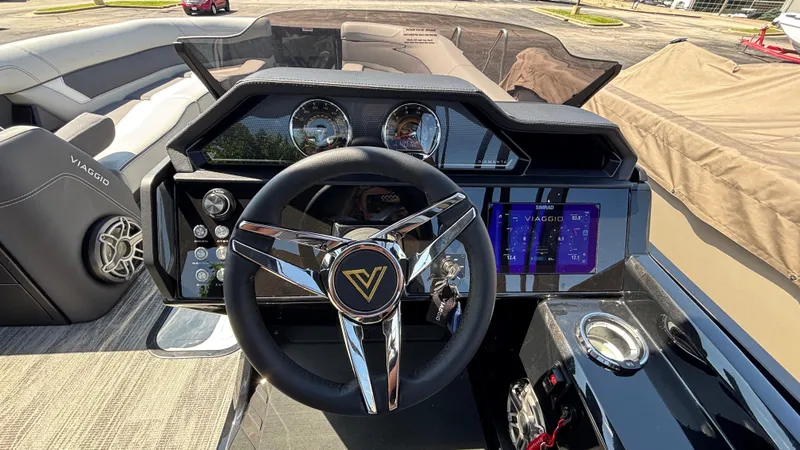 Slide: The Image of Steering console of 2025 Viaggio Diamante D26U boat with modern controls and display. - 16