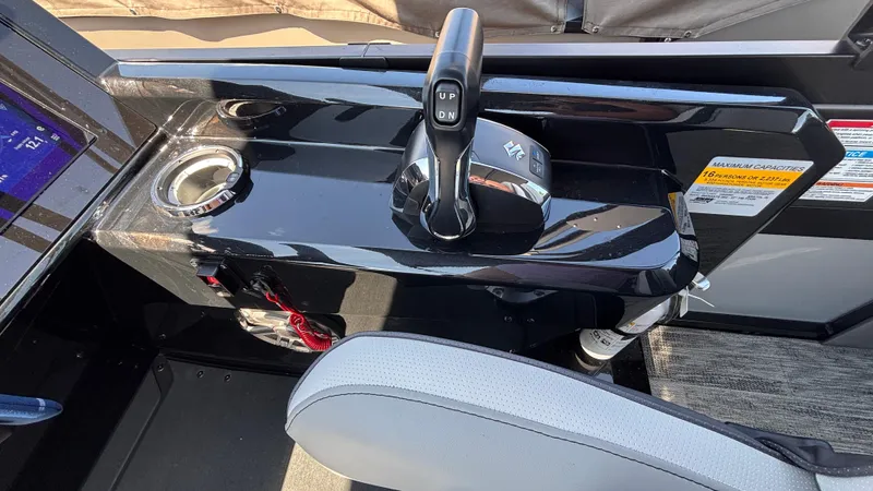 Slide: The Image of Control panel of 2025 Viaggio Diamante D26U boat with throttle and cup holder. - 18