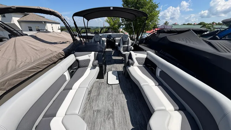 Slide: The Image of 2025 Viaggio Diamante D26U boat interior with luxurious seating and canopy under a sunny sky. - 28