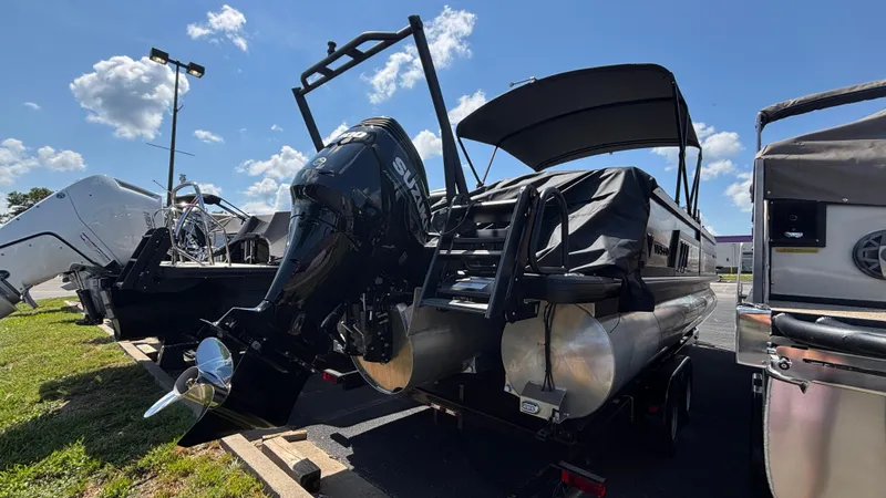 Slide: The Image of 2025 Viaggio Diamante D26U pontoon boat with Suzuki outboard motor, parked outdoors. - 3