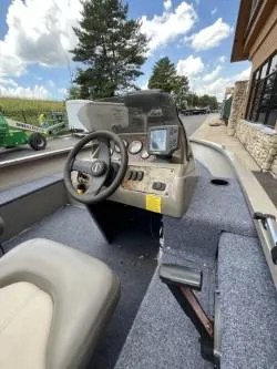 Slide: The Image of 2002 Tracker Pro Guide V-16 SC boat interior with steering console and gauges. - 3