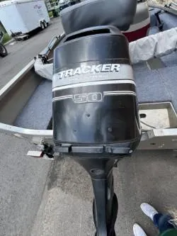 Slide: The Image of 2002 Tracker Pro Guide V-16 SC boat with 50 HP outboard motor. - 5