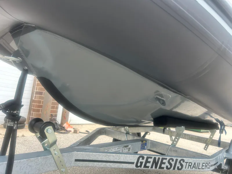Slide: The Image of 2025 Highfield Classic 310 FCT boat on Genesis trailer, close-up view. - 14