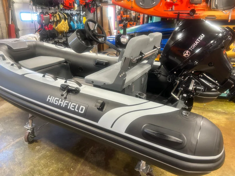 Slide: The Image of 2025 Highfield Classic 310 FCT inflatable boat with Tohatsu engine in showroom. - 3
