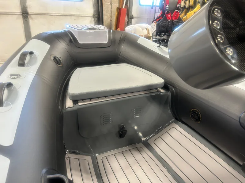 Slide: The Image of 2025 Highfield Classic 310 FCT boat interior with seating and control panel. - 5