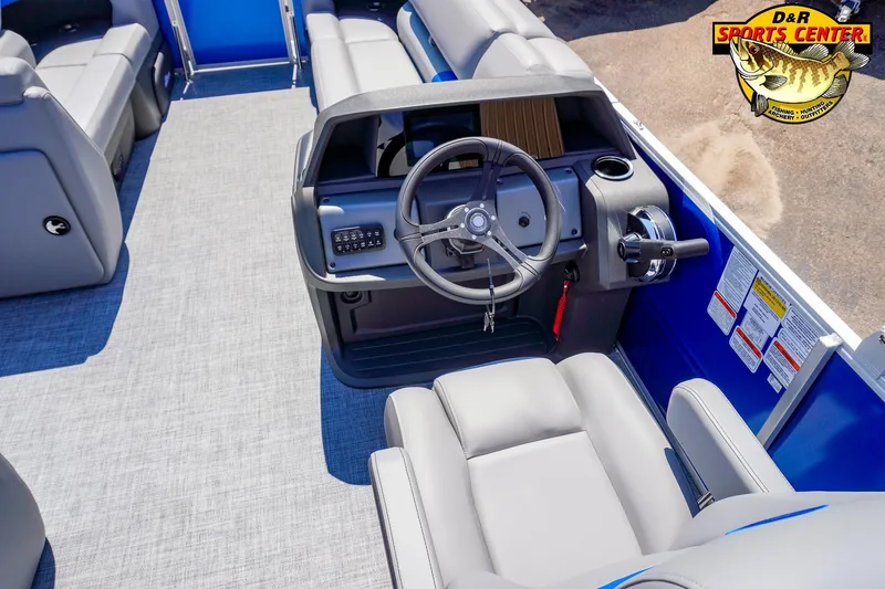 Slide: The Image of 2026 Sun Tracker Party Barge 20 DLX interior with steering wheel and seating. - 4