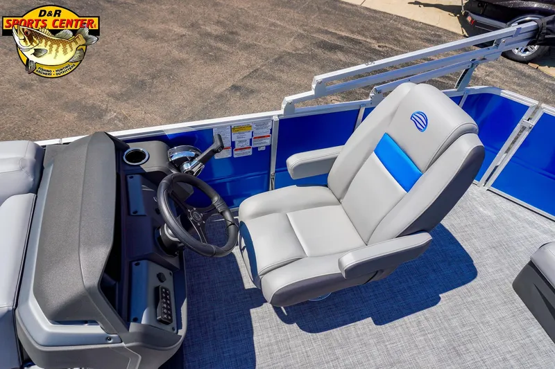Slide: The Image of 2026 Sun Tracker Party Barge 20 DLX interior with steering wheel and captain's chair. - 5