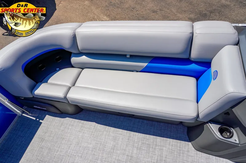 Slide: The Image of 2026 Sun Tracker Party Barge 20 DLX interior seating with gray and blue upholstery. - 7
