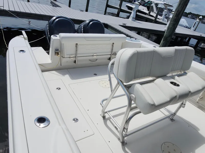 Slide: The Image of 2008 Robalo R300 Center Console boat with dual Yamaha engines at dock. - 12
