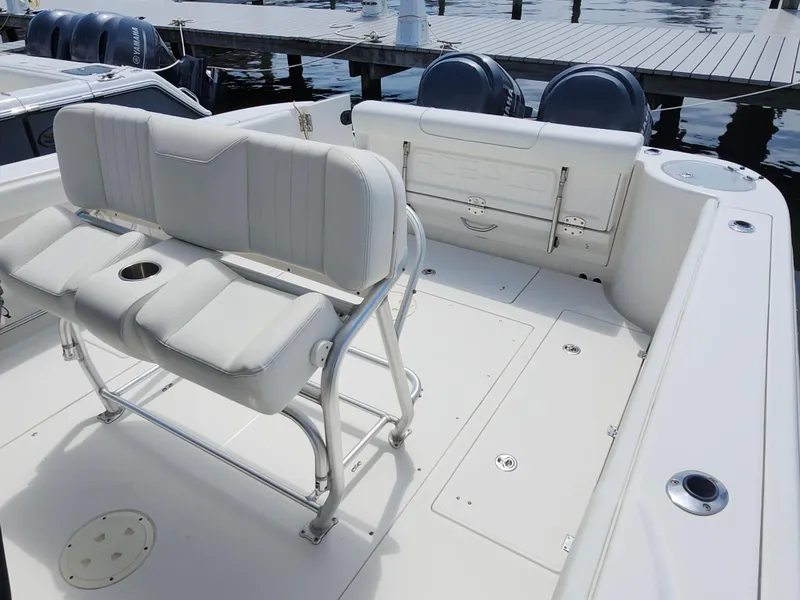 Slide: The Image of 2008 Robalo R300 Center Console boat interior with seating and dual Yamaha engines. - 14