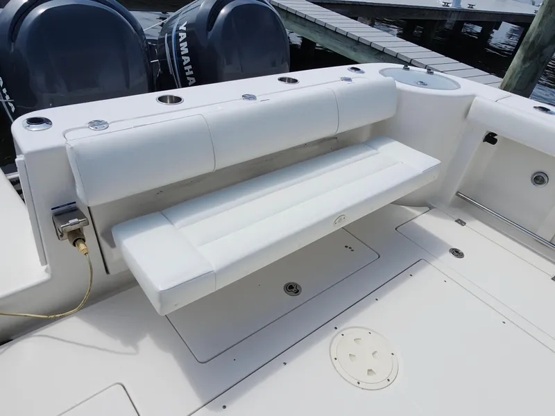 Slide: The Image of 2008 Robalo R300 Center Console boat with Yamaha engines and white seating. - 16