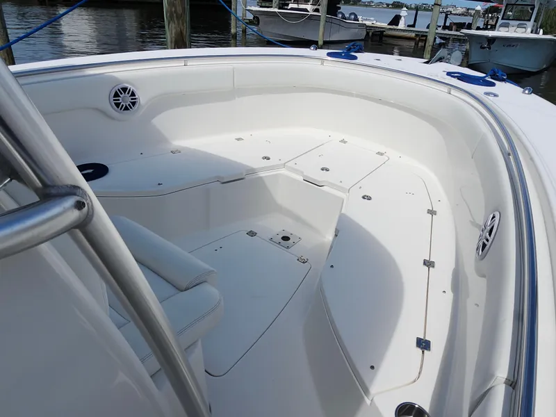Slide: The Image of 2008 Robalo R300 Center Console boat interior with seating and storage compartments. - 17