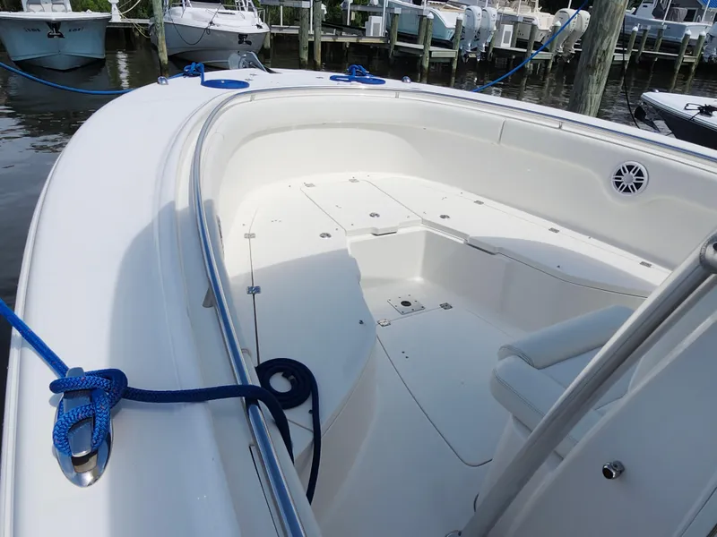 Slide: The Image of 2008 Robalo R300 Center Console boat interior with seating and blue dock lines. - 18