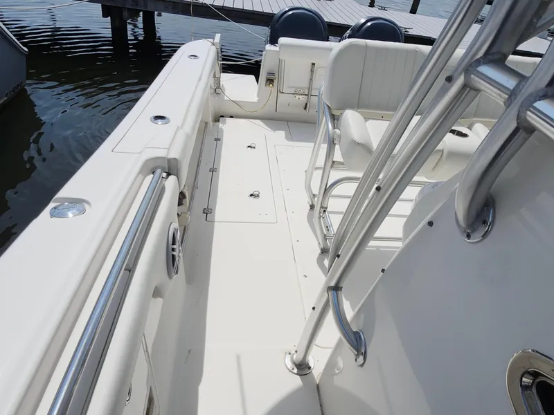 Slide: The Image of 2008 Robalo R300 Center Console boat interior with seating and stainless steel railings. - 19