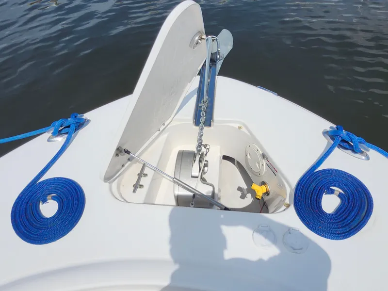 Slide: The Image of 2008 Robalo R300 Center Console anchor compartment with blue ropes and open hatch. - 25
