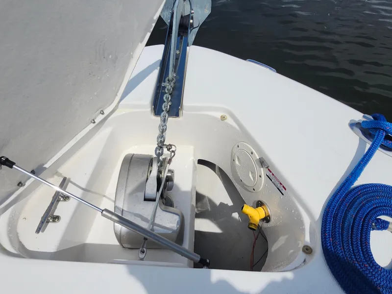 Slide: The Image of Anchor compartment of 2008 Robalo R300 Center Console with blue rope and chain. - 26