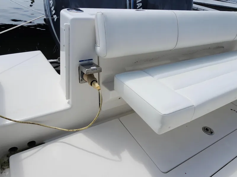 Slide: The Image of 2008 Robalo R300 Center Console boat with white seating and Yamaha engine. - 29