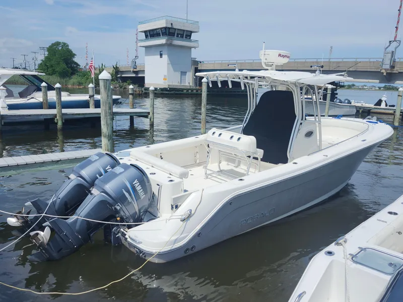 Slide: The Image of 2008 Robalo R300 Center Console boat docked with twin Yamaha engines. - 3