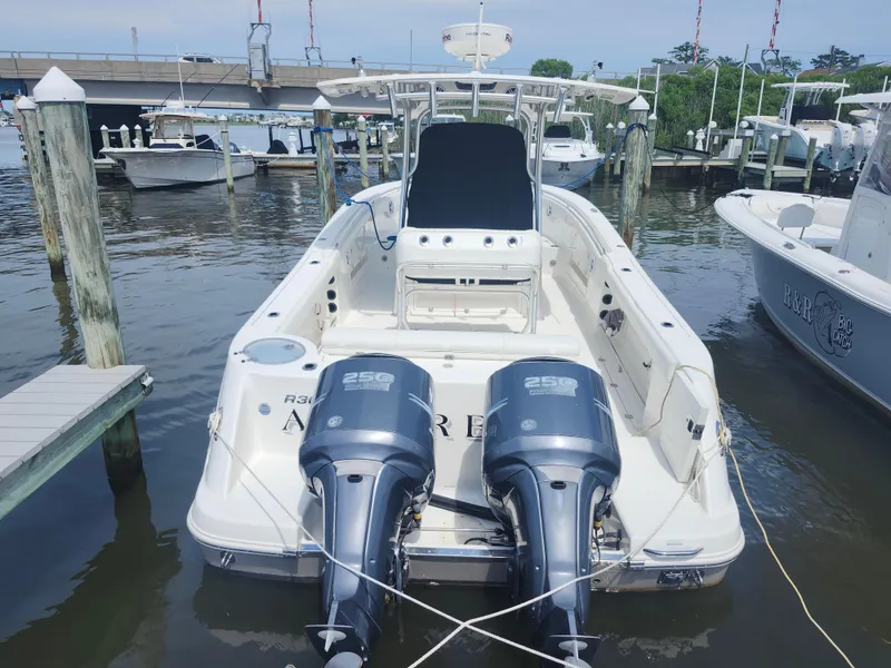 Slide: The Image of 2008 Robalo R300 Center Console boat docked with twin 250 horsepower engines. - 31