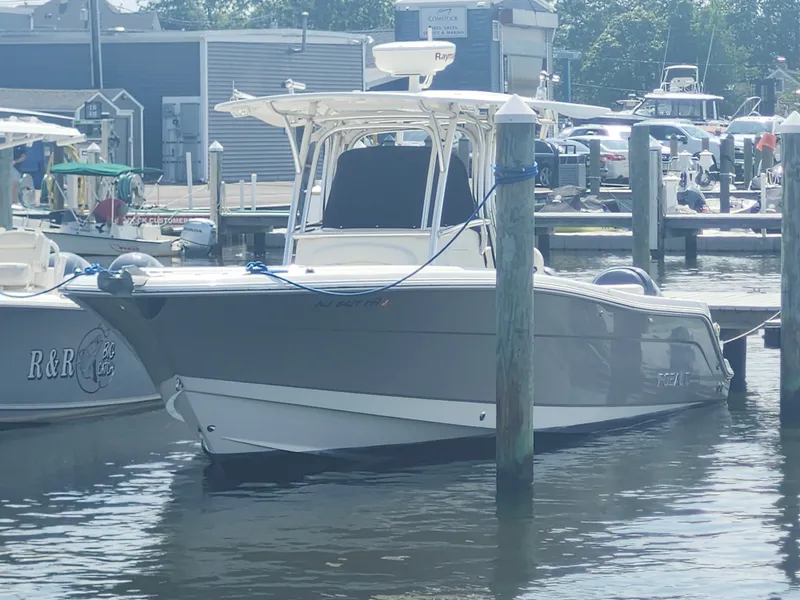 Slide: The Image of 2008 Robalo R300 Center Console boat docked at marina. - 5