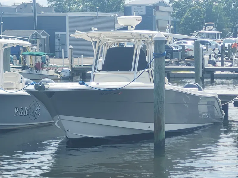 Slide: The Image of 2008 Robalo R300 Center Console boat docked at marina. - 6