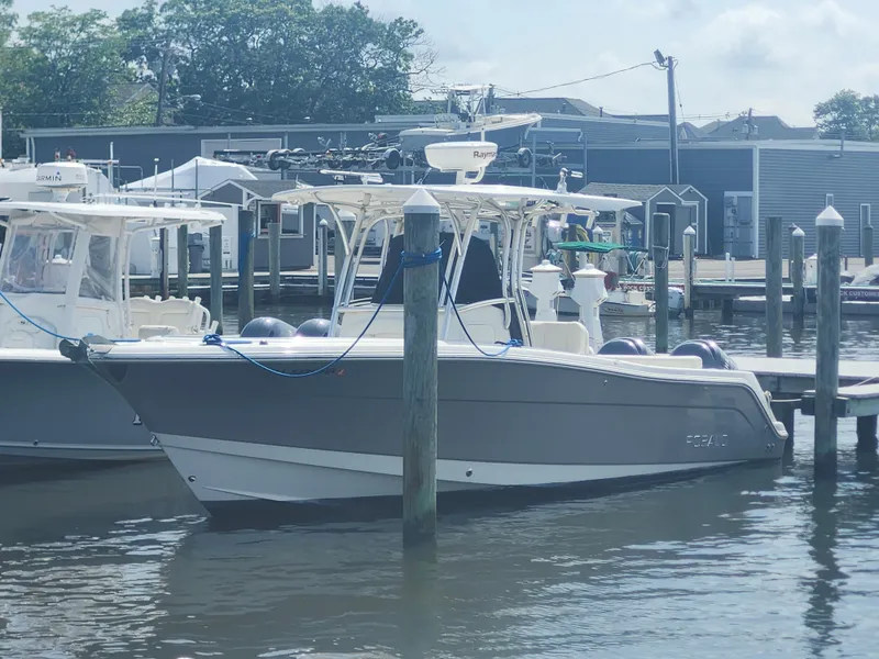 Slide: The Image of 2008 Robalo R300 Center Console boat docked at a marina. - 7