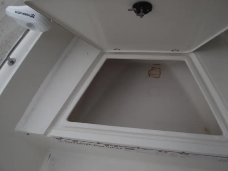 Slide: The Image of Open storage compartment on 2016 Key West 1720 Center Console boat. - 11