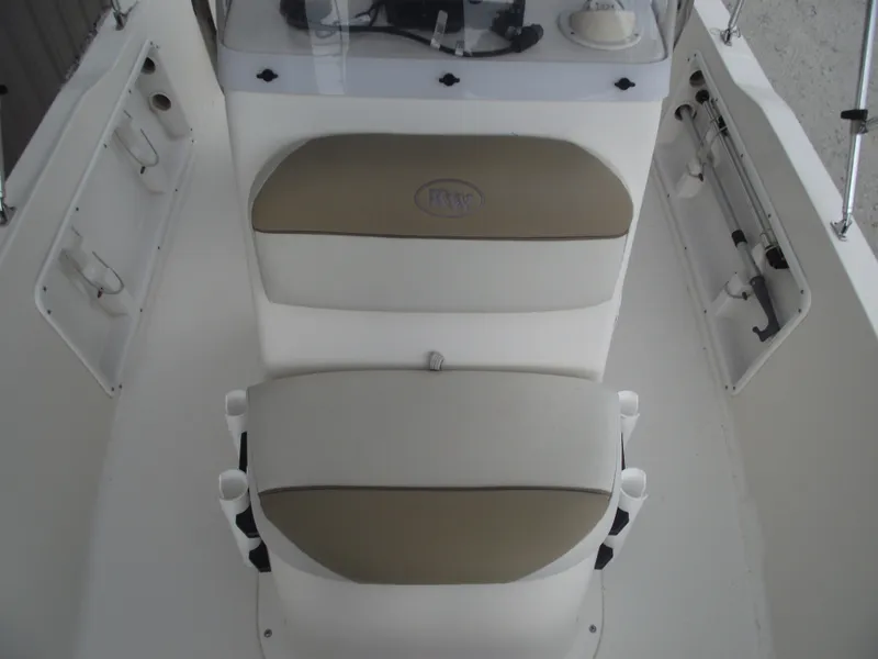 Slide: The Image of 2016 Key West 1720 Center Console boat interior with seating and storage compartments. - 12