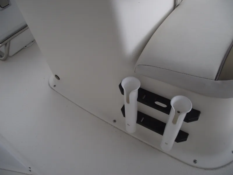 Slide: The Image of 2016 Key West 1720 Center Console boat interior with rod holders and seating. - 13