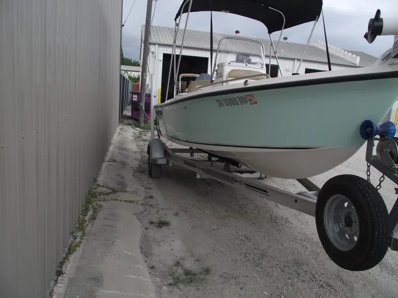 Slide: The Image of 2016 Key West 1720 Center Console boat on trailer near storage facility. - 2