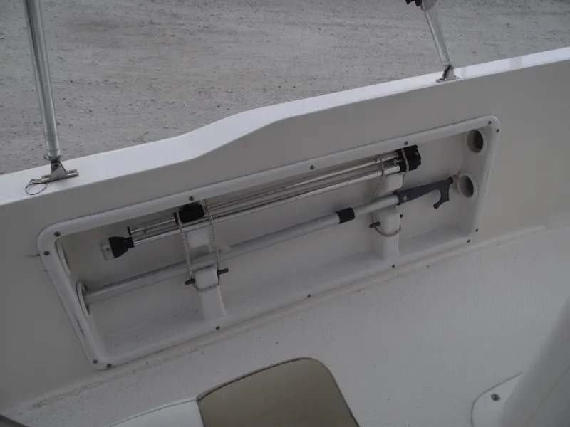 Slide: The Image of 2016 Key West 1720 Center Console boat interior with rod storage compartment. - 21
