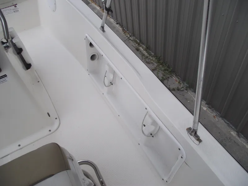 Slide: The Image of 2016 Key West 1720 Center Console boat interior with rod holders and seating. - 22