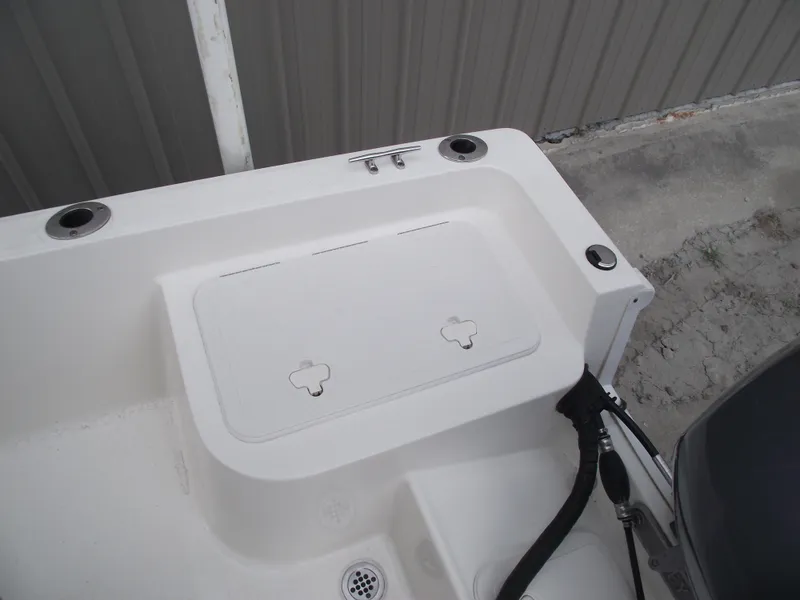 Slide: The Image of 2016 Key West 1720 Center Console boat deck with storage compartment. - 23