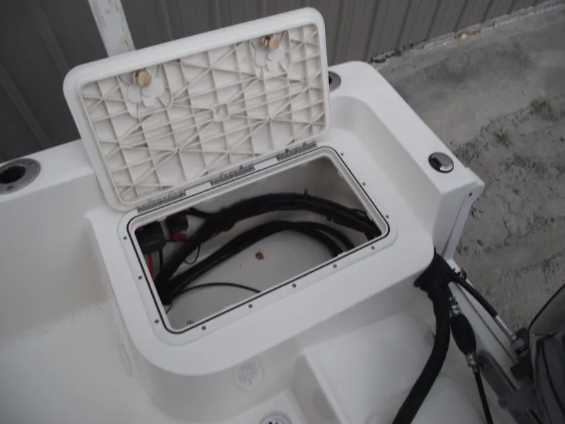 Slide: The Image of Open storage compartment on a 2016 Key West 1720 Center Console boat. - 24