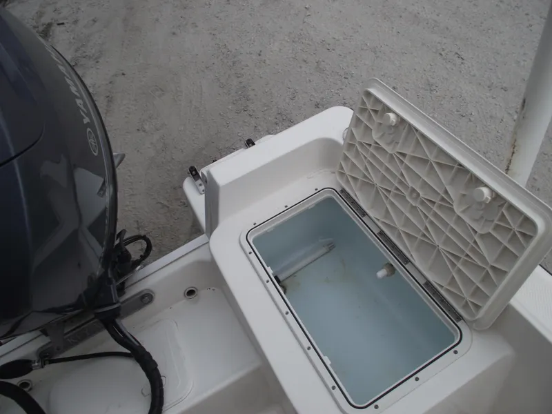 Slide: The Image of 2016 Key West 1720 Center Console boat with open storage compartment and Yamaha engine. - 27