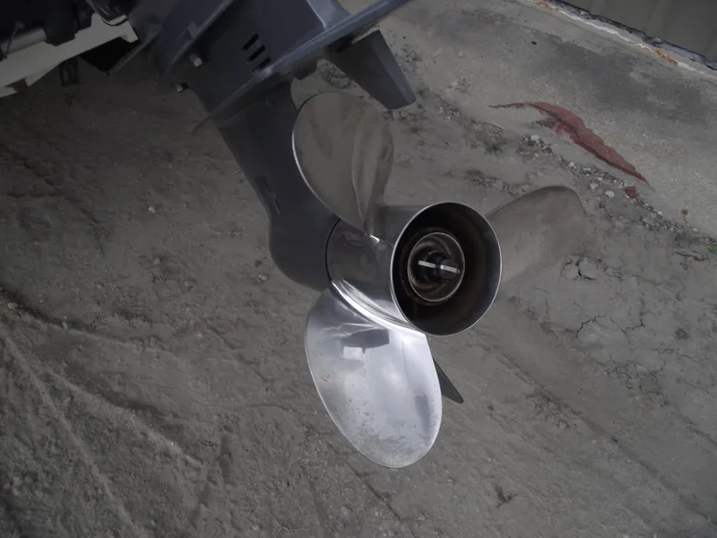 Slide: The Image of Propeller of 2016 Key West 1720 Center Console boat on sandy ground. - 5